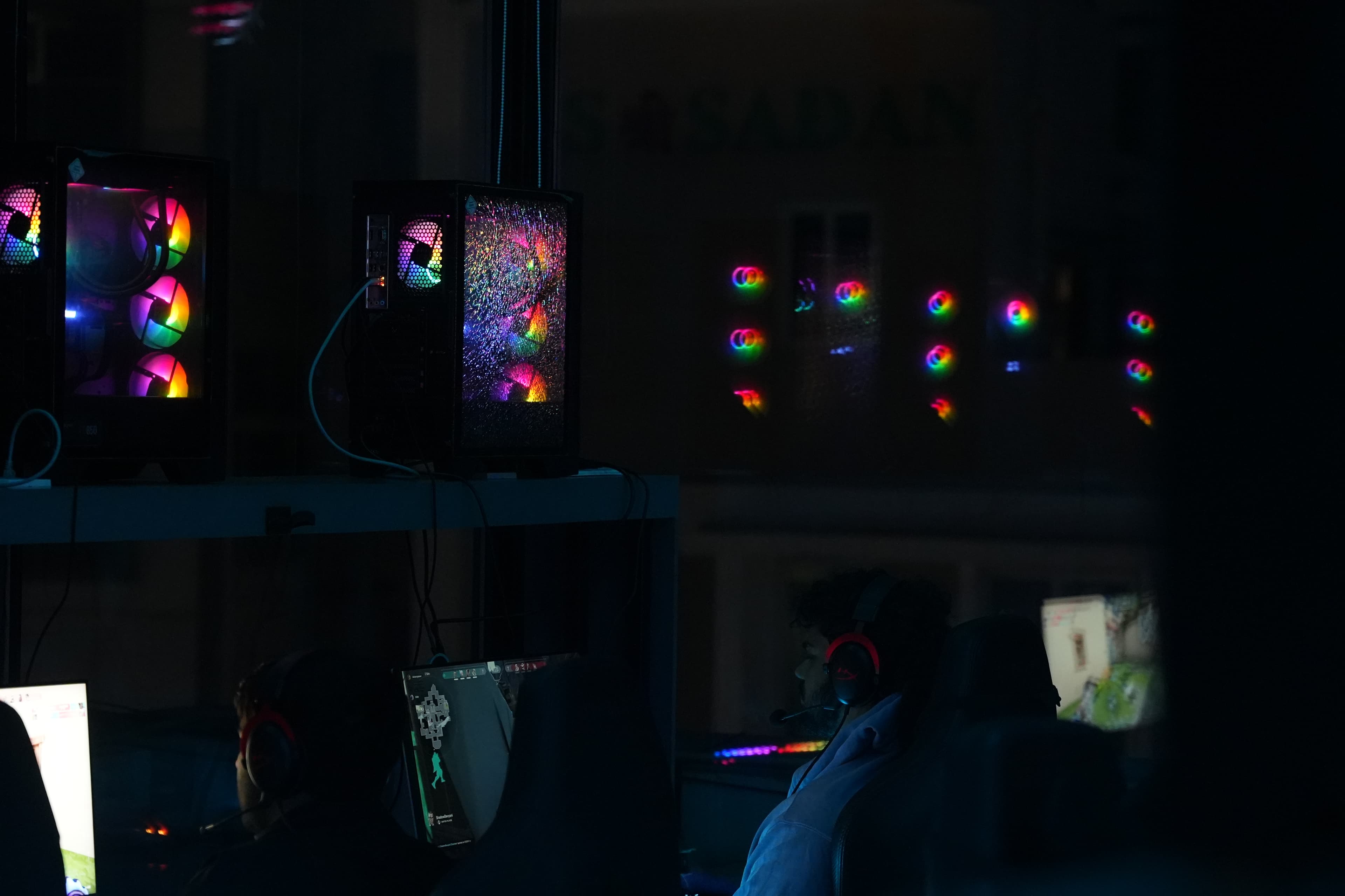 RGB tower PCs glowing across the gaming floor at Gamers Guild